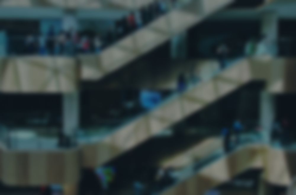 Store floor, softly blurred, behind an incoming StorePulse alert